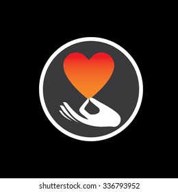 heart or love symbol in hand vector logo icon on black. this also represents compassion, empathy, care and concern, expressing love, liability, intimacy