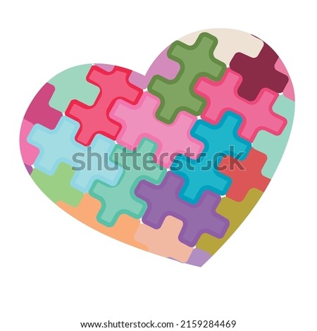 Heart made up of colored puzzle pieces.