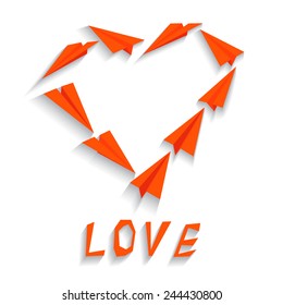 Heart made of red origami paper planes. Valentines day greeting card