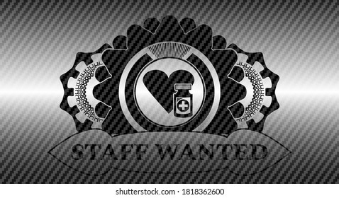 heart medicines icon and STAFF WANTED text carbon fiber dark emblem. Polymer texture handsome background. Illustration. 