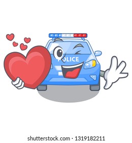 With heart miniature cartoon police car on table