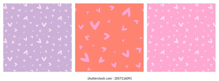 Heart non directional seamless pattern set in pink, lilac and orange girly colours. Hand drawn love symbols vector repeat backgrounds.