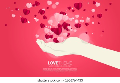 Heart paper art flying from hand background concept. valentine's day and love theme banner and poster
