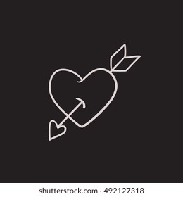 Heart pierced with arrow vector sketch icon isolated on background. Hand drawn Heart pierced with arrow icon. Heart pierced with arrow sketch icon for infographic, website or app.