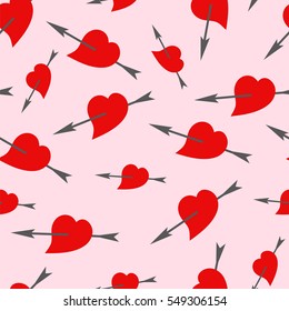 Heart pierced by an arrow. Seamless background. Vector.