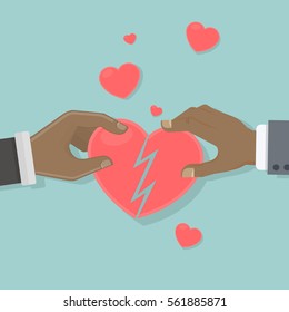 Heart recovery concept. Two african american hands hold and connect pieces of heart.