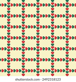 Heart ribbon repeat pattern isolated on background.Christmas seamless pattern with green and red hearts.Graphic vector illustration.