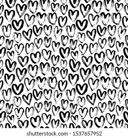 Heart seamless pattern. Black and white ink brush hearts hand drawn ornament. Romantic figures vector illustration. Monochrome freehand dry paint brush stroke shapes. Decorative textile, wallpaper