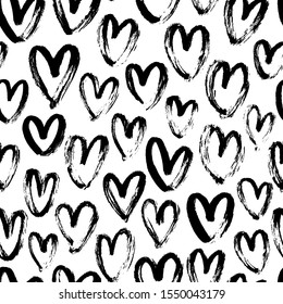 Heart seamless pattern. Black and white ink brush hearts hand drawn ornament. Romantic figures vector illustration. Monochrome freehand dry paint brush stroke shapes. Decorative textile, wallpaper