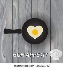 Heart shape fried egg on frying pan vector. Frying pan with fried eggs finished dish.  Bon Appetit!  Black frying pan. 