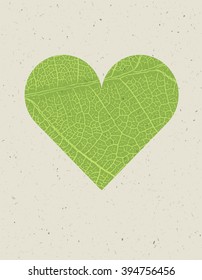 Heart shape with green leaf texture. Nature background with free space for text or image. Green leaf veins texture heart shaped on the recycled paper texture.