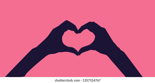 Heart shape hand gesture isolated on pink