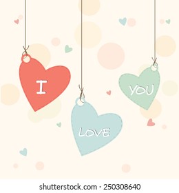 Heart shape hanging tags with text I Love You for Happy Valentines Day celebration.
