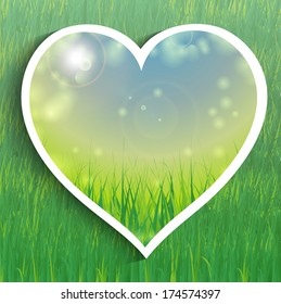 Heart shape on green grass background