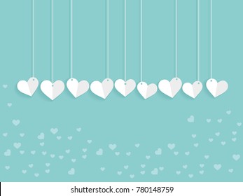 heart shape paper folded in soft green background 