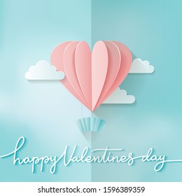 Heart shape Pink hot air balloon flying. Love in paper cut style. Origami heart and clouds. Happy Valentine's day hand lettering. Romantic Holidays. 14 February