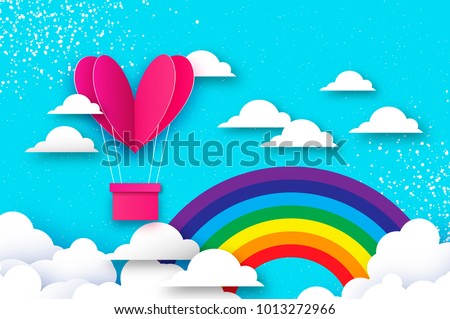 Heart shape Pink hot air balloon flying. Love in paper cut style. Origami Valentine day. Romantic Holidays. 14 February. Be my valentine. Blue sky with origami clouds and rainbow.