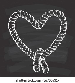 heart shape tied rope on chalkboard background