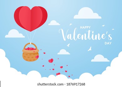 A heart shaped balloon floating in the sky with a basket filled with red hearts to give gifts to couples.