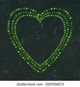 Heart Shaped Frame of Green Clovers on Black Board Background. St Patricks Day Vector Illustration Hand Drawn. Savoyar Doodle Style.