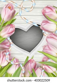 Heart shaped frame with tulips on white wooden background. EPS 10 vector file included