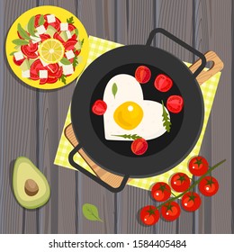 Heart shaped fried eggs in a pan, tomatoes and avocados