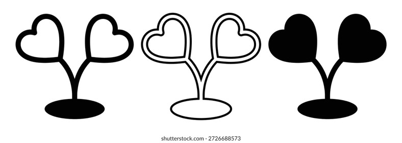 Heart shaped leaves on tree branches in black and white,hearten tree Black Silhouette.Heart shaped leaves on plants in different styles and colors
