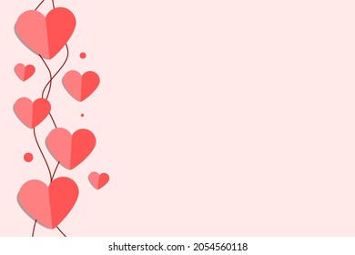 Heart shaped paper cut in pink background