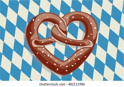 Heart shaped salty pretzel bread on bavarian state flag. Oktoberfest theme with typical food shaped as heart