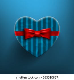 Heart shaped Valentines Day gift box with red bow and ribbon