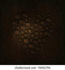 Heart shaped water drops on a wooden texture.