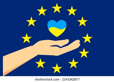 Herzzeichen in ukrainischen Flaggenfarben in Hand auf dem Hintergrund einer Europaeisenflagge mit gelben Sternen