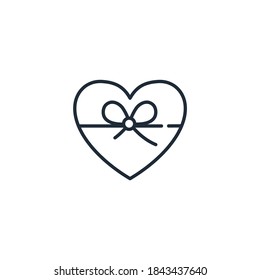 Corazón atado con una cinta de regalo. Icono lineal vectorial aislado en fondo blanco.