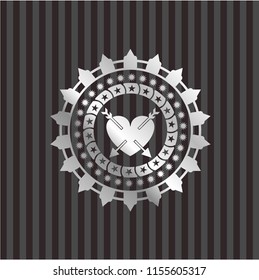heart with two arrows icon inside silver badge
