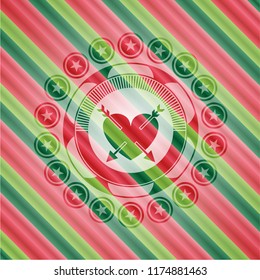 heart with two arrows icon inside christmas emblem.