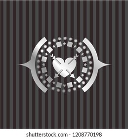 heart with two arrows icon inside silvery emblem or badge