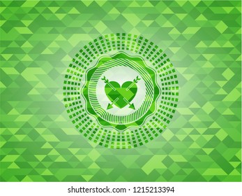 heart with two arrows icon inside green emblem with mosaic background