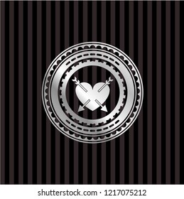 heart with two arrows icon inside silver badge