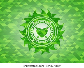 heart with two arrows icon inside green emblem. Mosaic background