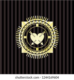 heart with two arrows icon inside gold emblem