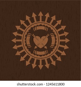 heart with two arrows icon inside vintage wooden emblem