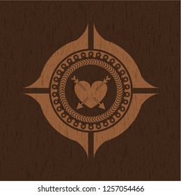 heart with two arrows icon inside retro wood emblem