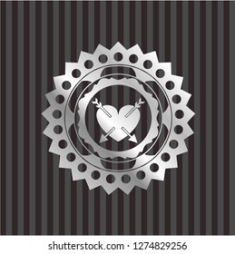 heart with two arrows icon inside silvery badge