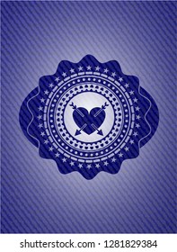 heart with two arrows icon inside emblem with denim high quality background