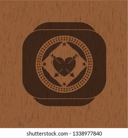 heart with two arrows icon inside wood emblem