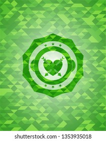 heart with two arrows icon inside realistic green emblem. Mosaic background