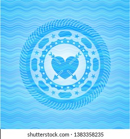heart with two arrows icon inside light blue water emblem background.