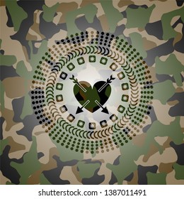 heart with two arrows icon inside camouflaged emblem