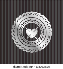 heart with two arrows icon inside silvery badge