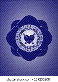 heart with two arrows icon inside denim background